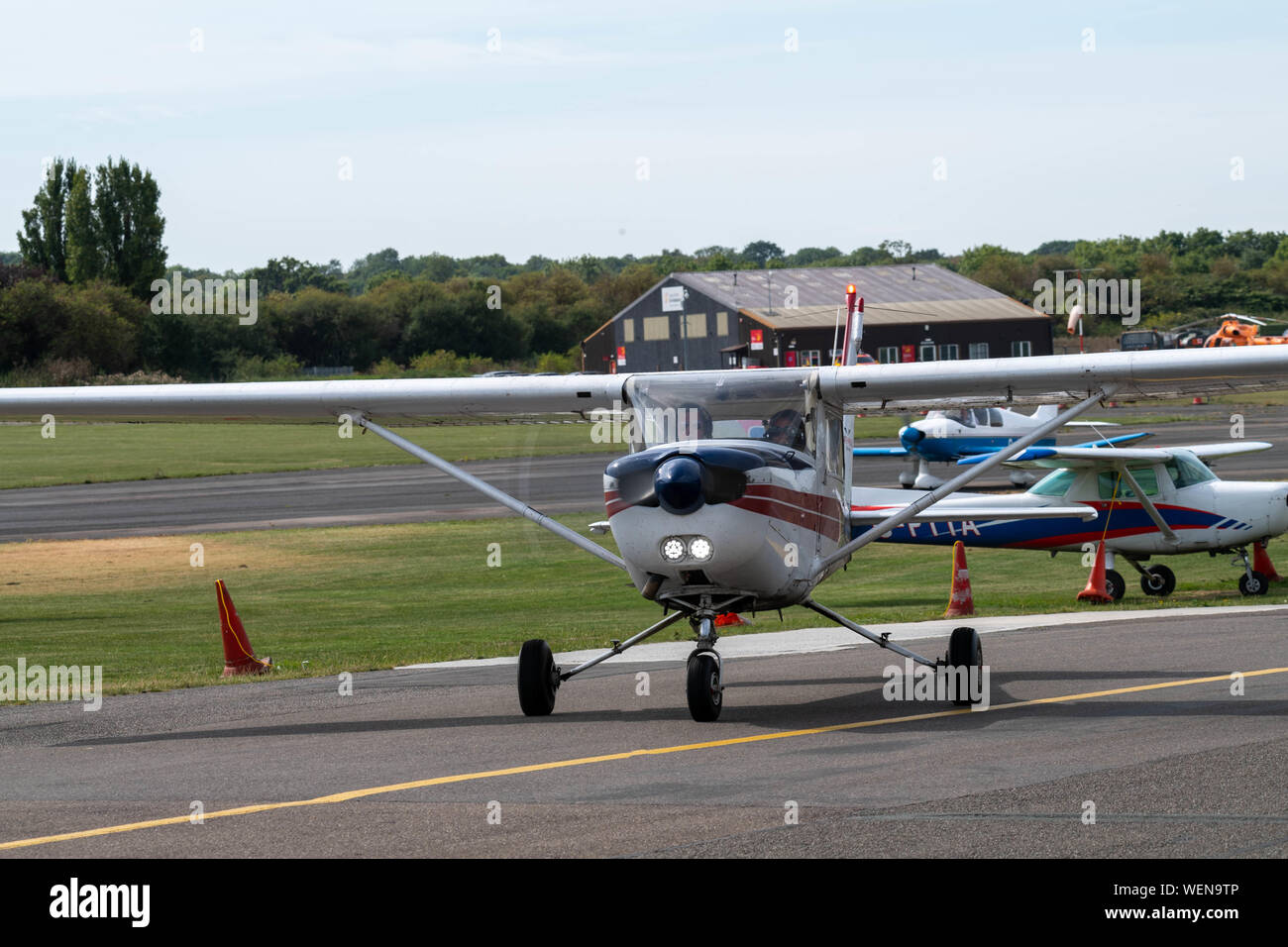Reims Cessna FA152, G-bhmg, lands from a training flight at North Weald Airfield Stock Photo