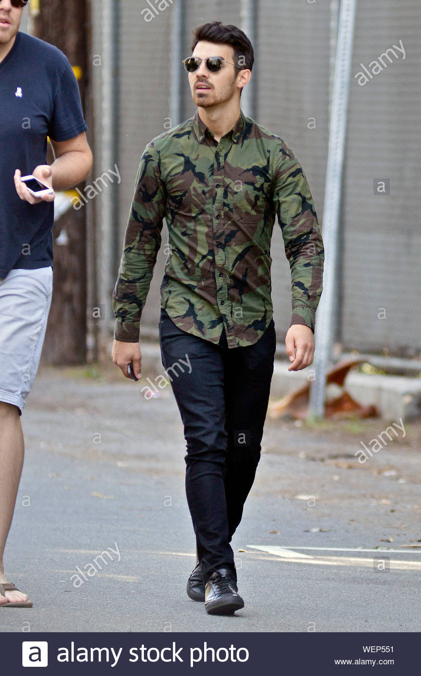 camo shirt with blue jeans