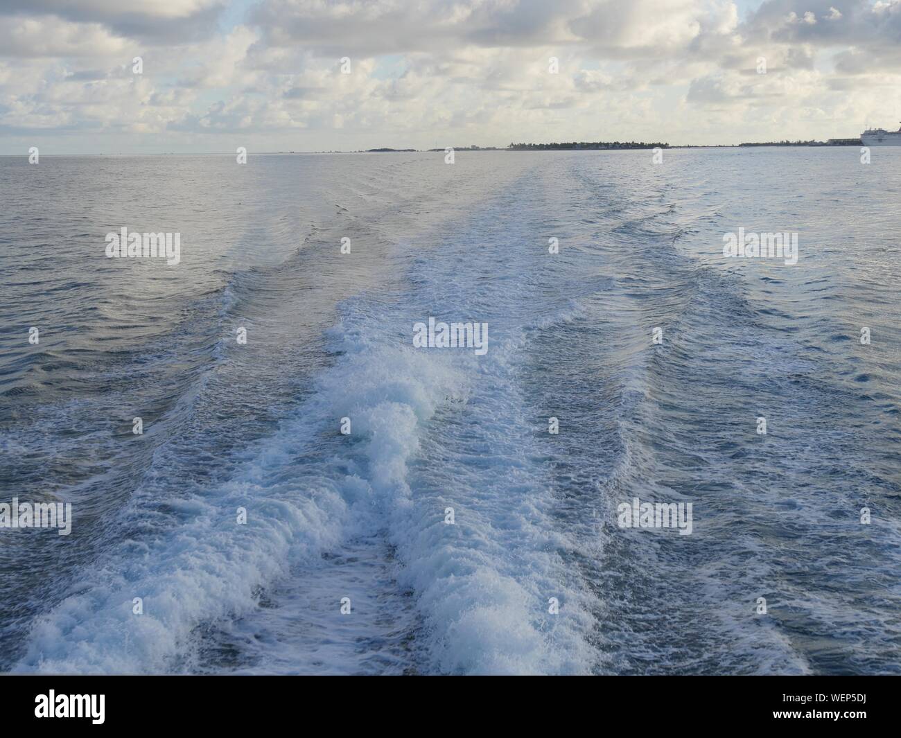 Rippling waters created by a boat engine in the ocean Stock Photo - Alamy
