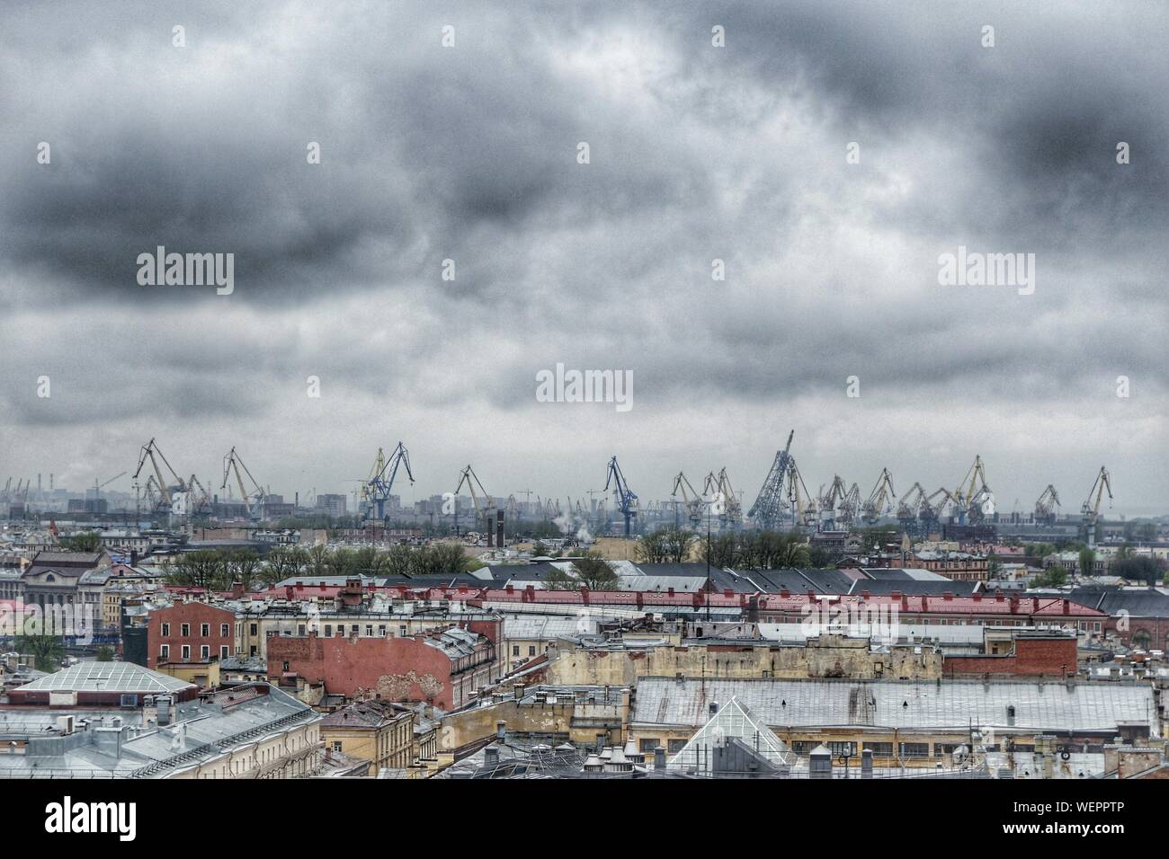 High Angle View Of Industrial Area Against Storm Clouds Stock Photo