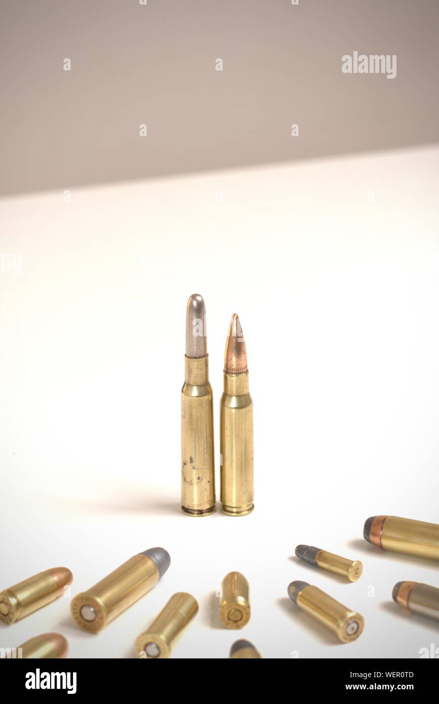 https://c8.alamy.com/comp/WER0TD/two-bullets-standing-before-many-smaller-bullets-it-works-as-a-concept-for-power-obedience-domination-crime-family-WER0TD.jpg