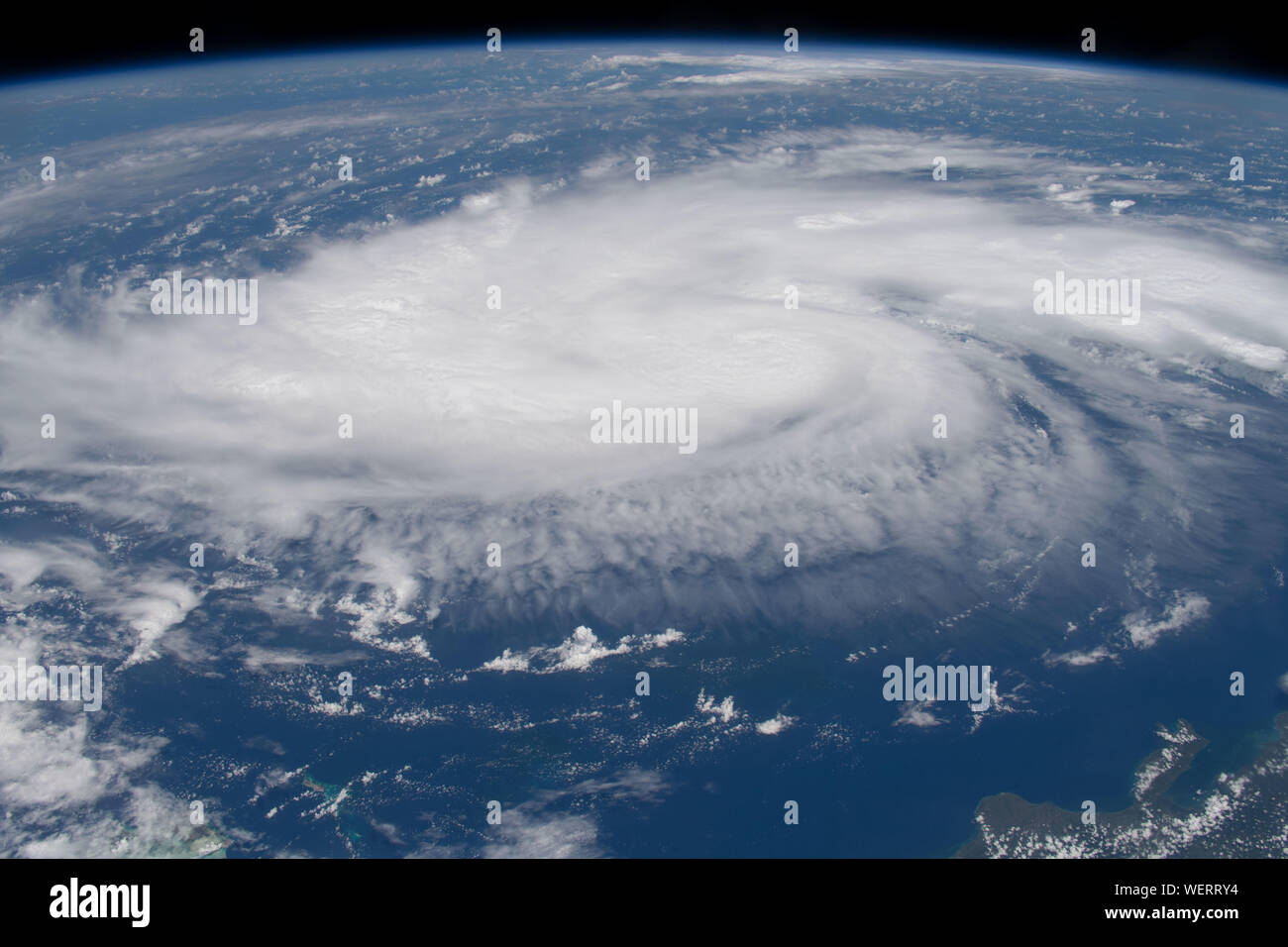 International Space Station, USA. 29 August 2019. The cyclonic clouds of Hurricane Dorian seen from the International Space Station as it churns through the Caribbean August 29, 2019 in the Atlantic Ocean. The current forecast calls for Dorian to strengthen over open water to a Category 4 with winds of 140 mph before making landfall in South Florida late Monday.  Credit: NASA/Planetpix/Alamy Live News Stock Photo