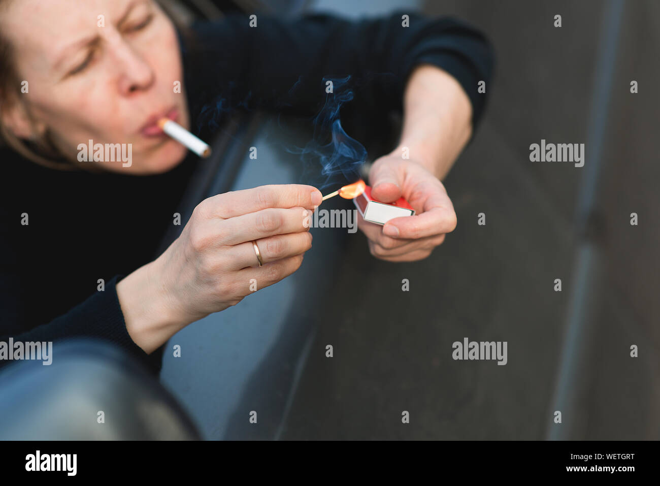 Closeup Of Woman Lighting Cigarette Stock Photo Alamy