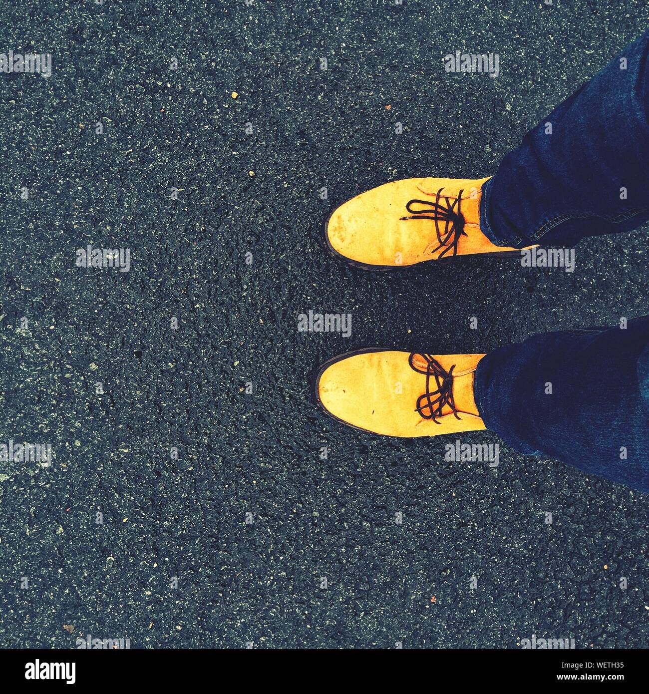 wearing yellow shoes