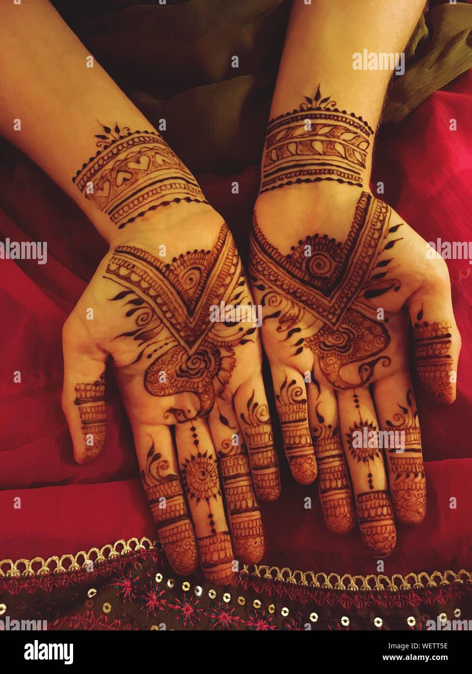Midsection Of Woman With Henna Tattoo On Hands Stock Photo Alamy