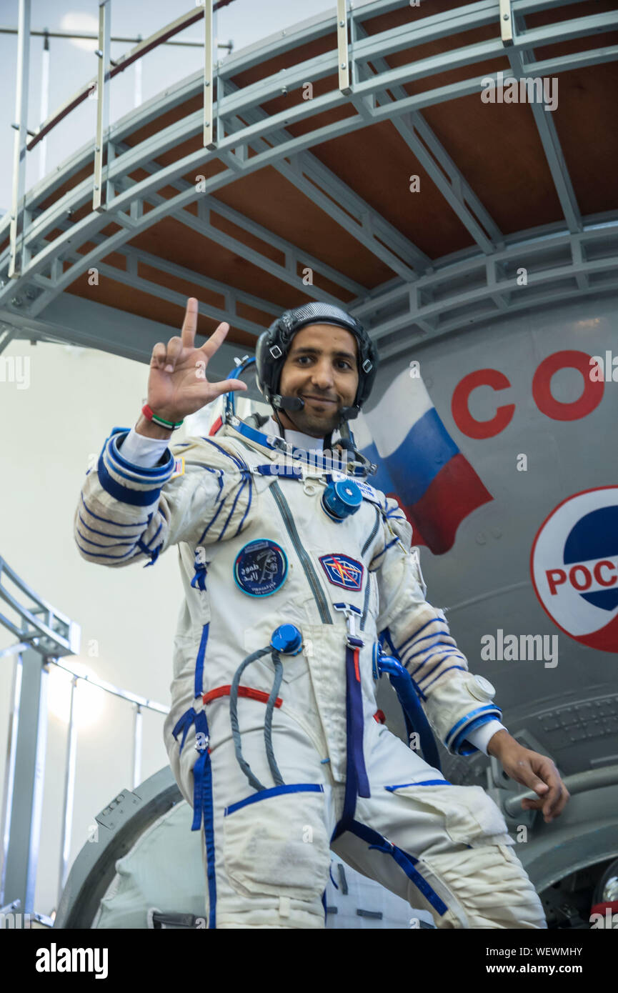 Star City, Russia. 30 August 2019. International Space Station Expedition 61 spaceflight participant Hazzaa Ali Almansoori of the United Arab Emirates in his Sokol space suit climbs aboard a Soyuz trainer during final crew qualification exams at the Gagarin Cosmonaut Training Center August 30, 2019 in Star City, Russia. Expedition 61-62 is expected to launch to the International Space Station on September 25, 2019. Credit: NASA/Planetpix/Alamy Live News Stock Photo