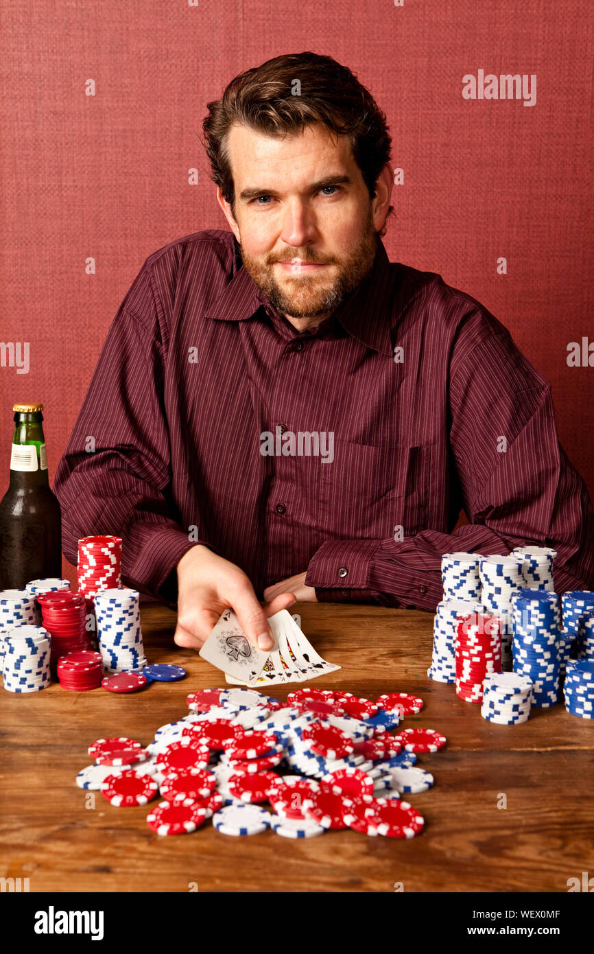 man winning at poker with full house Stock Photo Alamy