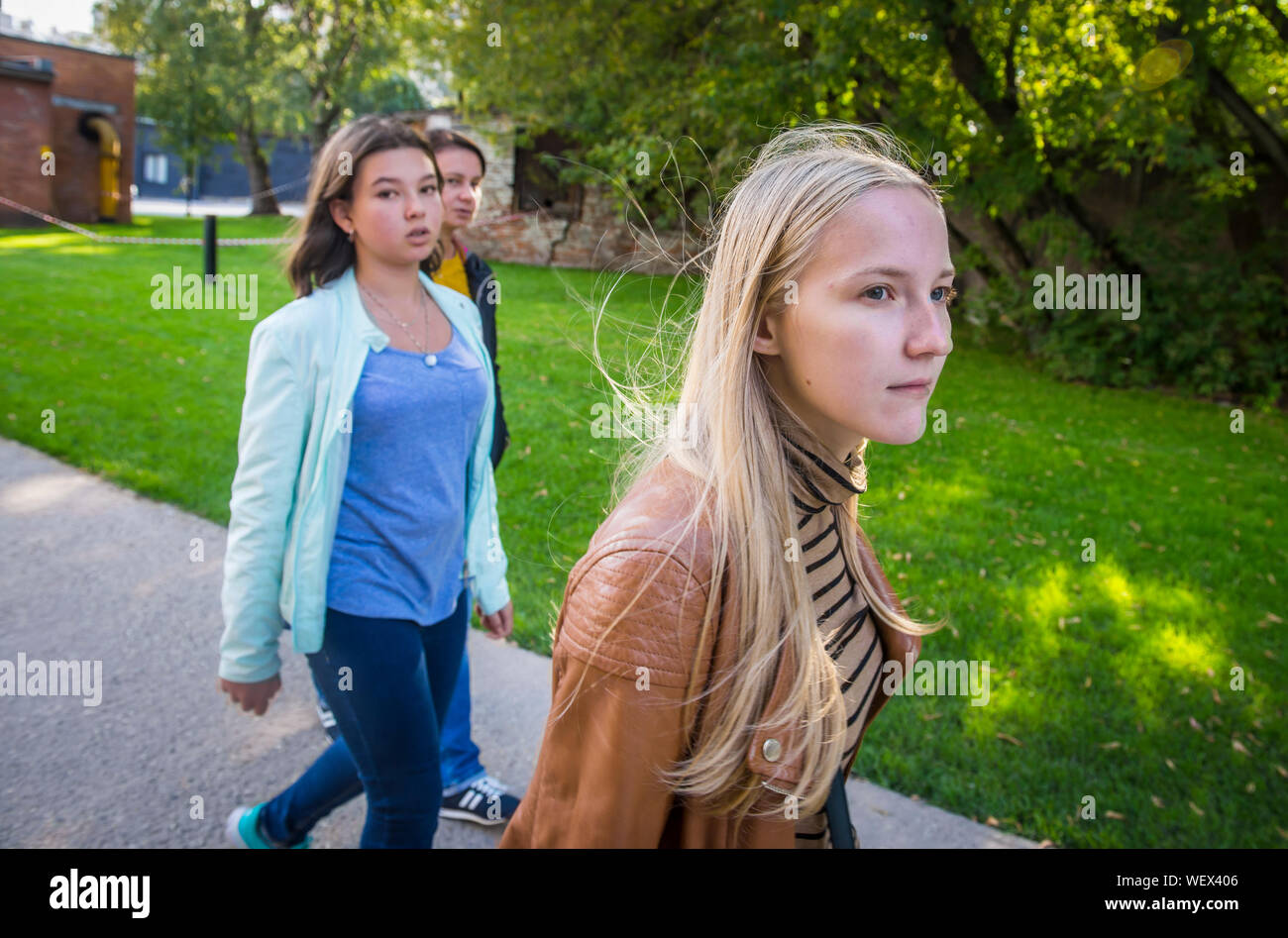 Teenage Girls Walking On Footpath Stock Photo
