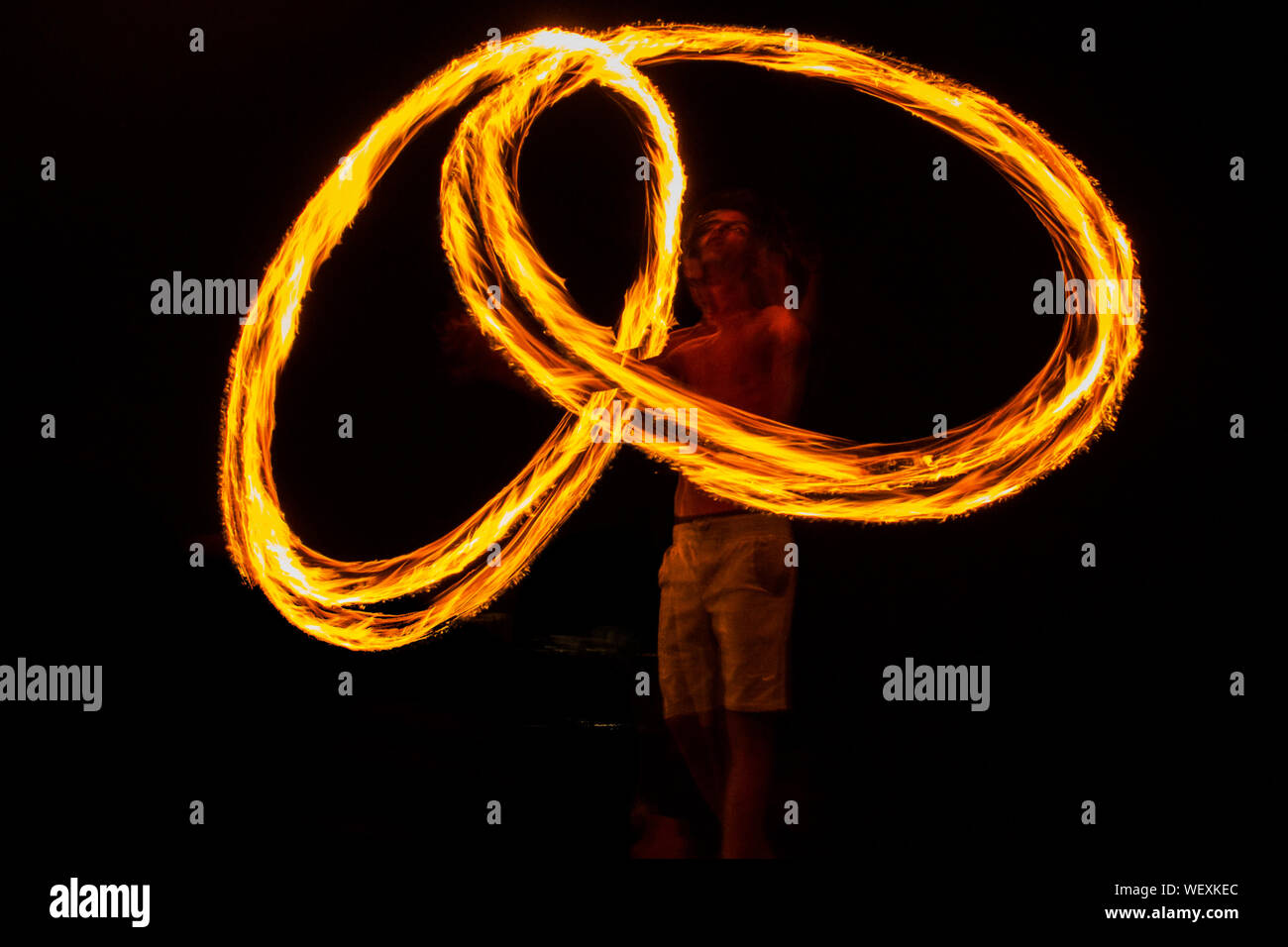 Fire Dancer Performing At Night Stock Photo Alamy