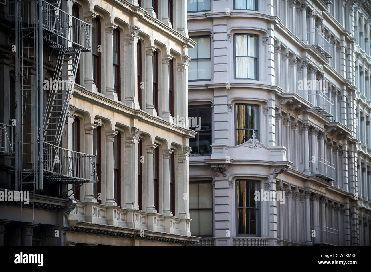 Architectural detail view of traditional cast iron buildings in the Soho Cast Iron Historic District in downtown Manhattan, New York City Stock Photo