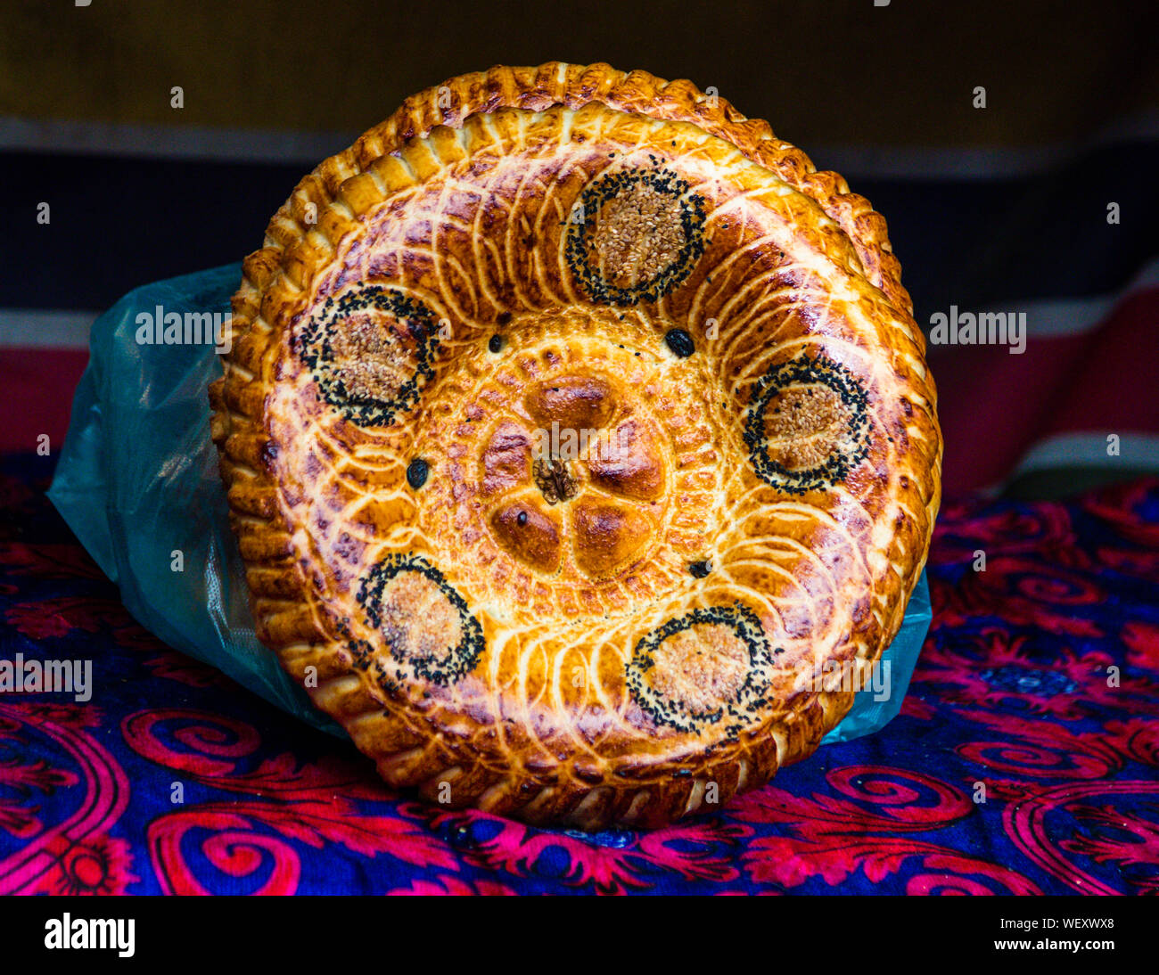 Tajik Non (Naan). Fresh round Bread in the City of Osh, Kyrgyzstan Stock Photo