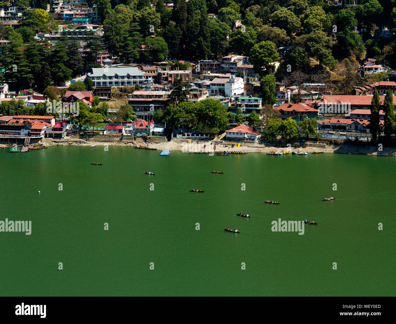 Tourists canoeing at Nainital Lake at Nainital, a hill station in Uttarakhand, India Stock Photo