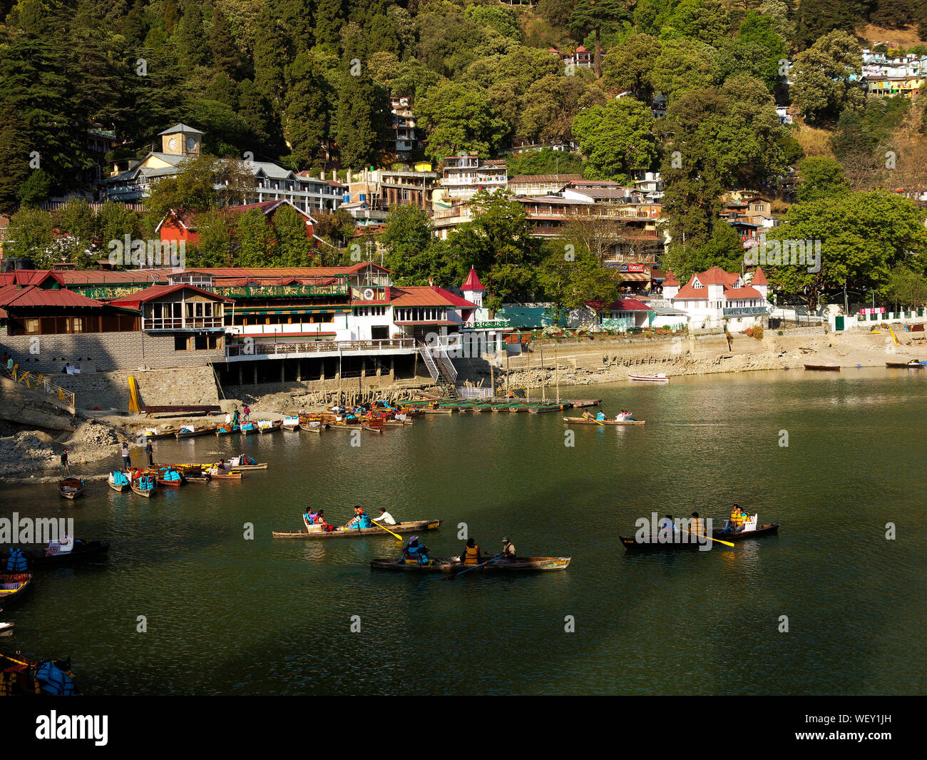 Tourists canoeing at Nainital Lake at Nainital, a hill station in Uttarakhand, India Stock Photo