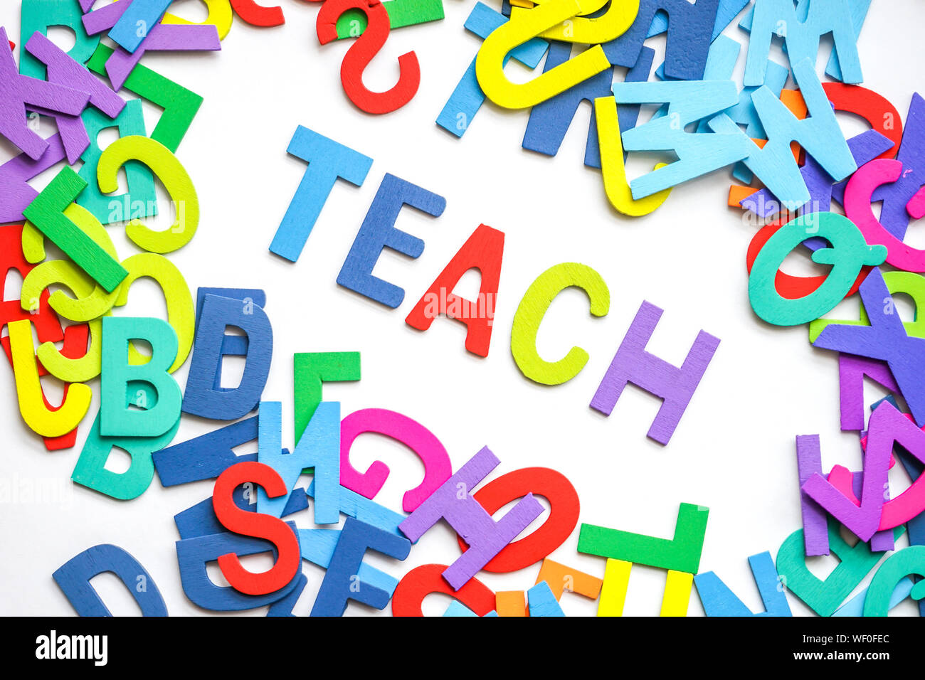 Teach Text With Colorful Alphabets On White Background Stock Photo
