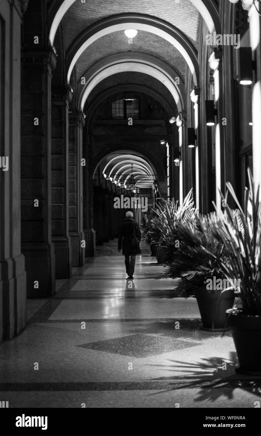 Woman walking street corridor Black and White Stock Photos & Images - Alamy