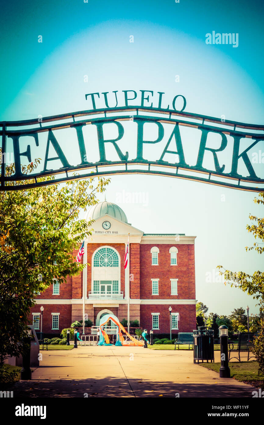 A view of the overhead metal sign for Tupelo Fair Park  in front of the Tupelo City hall building, Elvis Presley preformed his 1956 homecoming concert Stock Photo