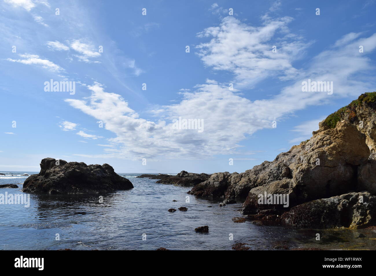 Scenic View Of Sea Against Cloudy Sky Stock Photo