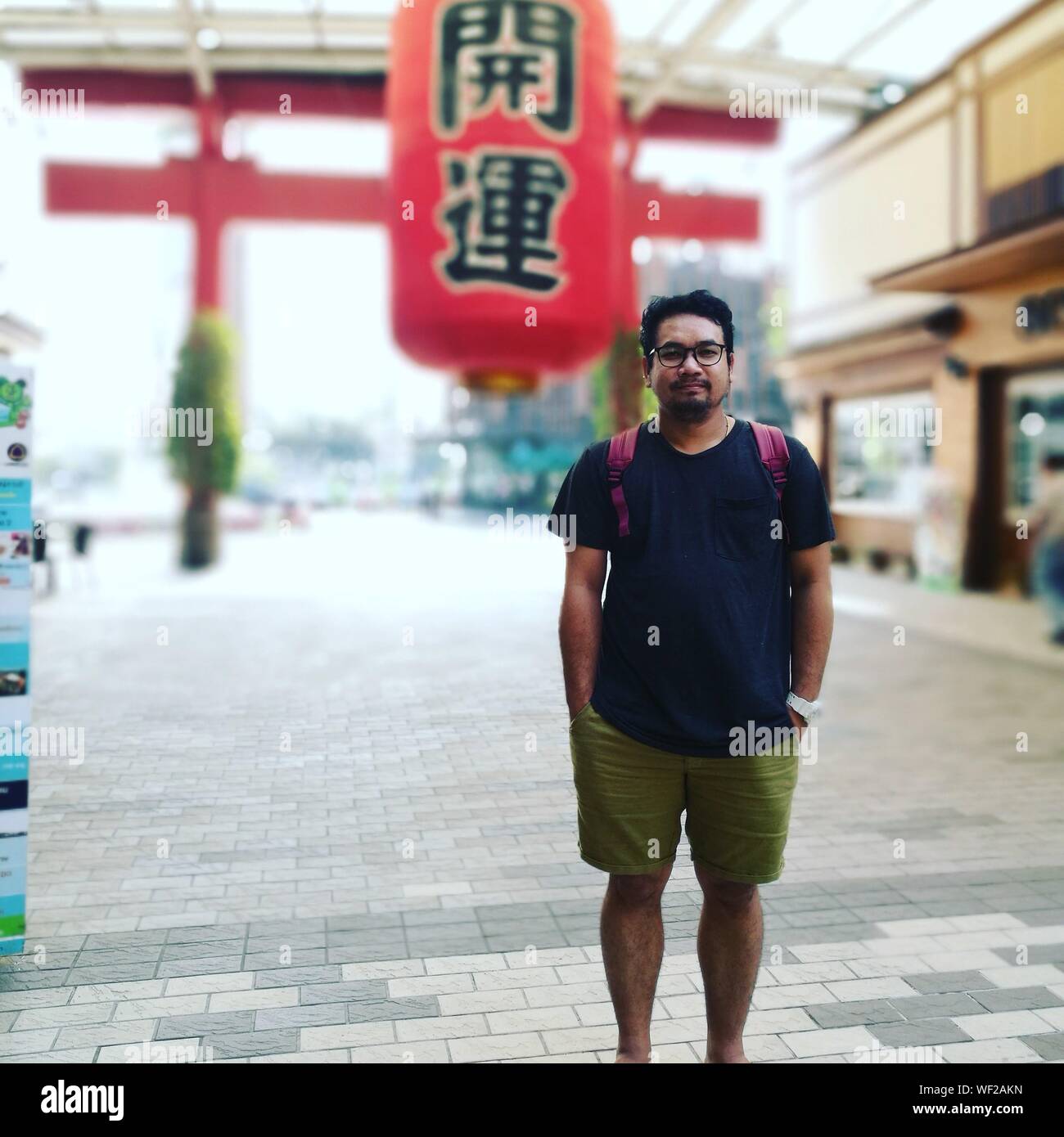 Indian man in shorts standing hi-res stock photography and images - Alamy