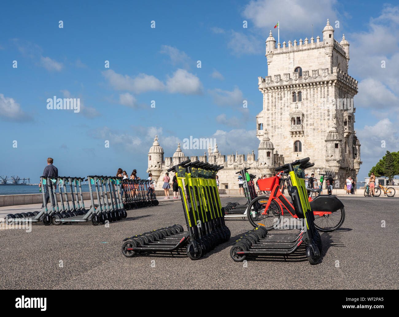 Mulitple electric scooters in Lisbon by the Belem Tower Stock Photo