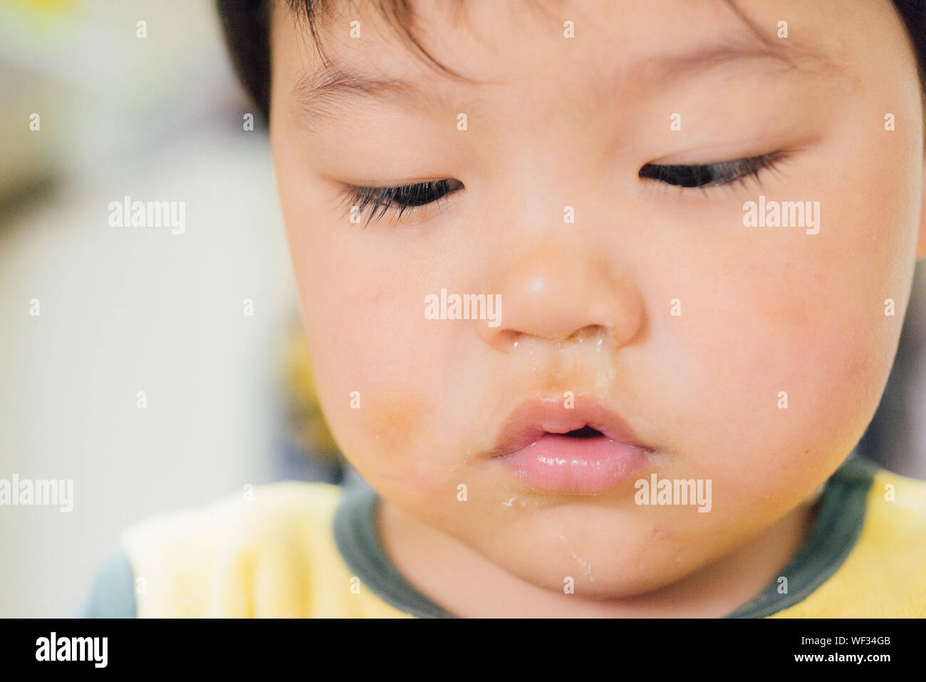 Close-up Of Boy With Mucus Stock Photo