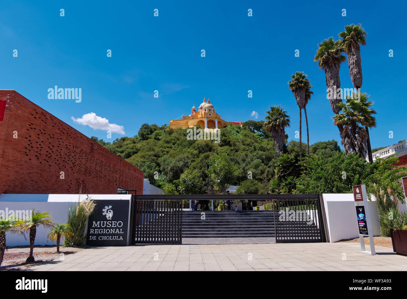 San Andres Cholula, Mexico, September 30, 2018 - Beautiful Shrine of Our Lady of Remedies sanctuary and Regional Museum at sunny day with blue sky. Stock Photo