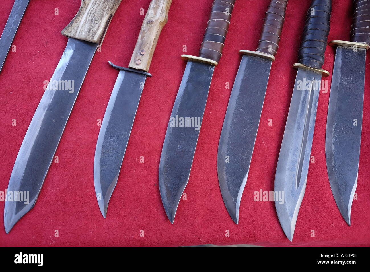 High Angle View Of Daggers On Red Fabric Stock Photo