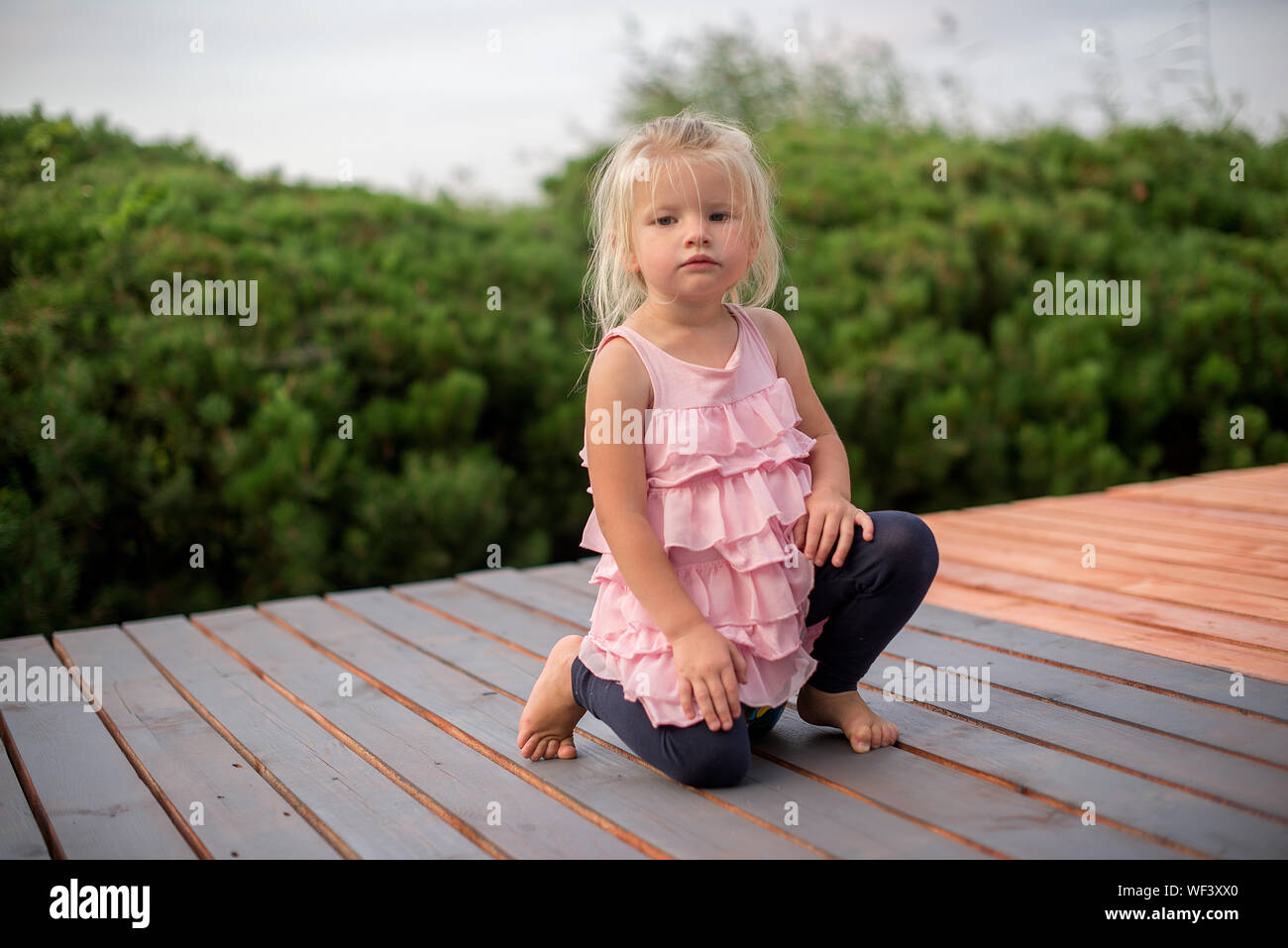 Full length kneeling hi-res stock photography and images - Alamy