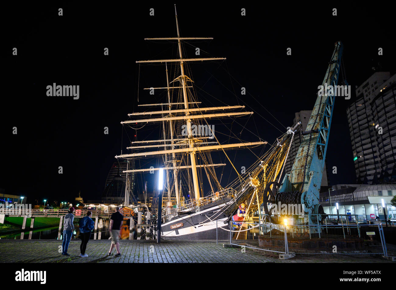 Bremerhaven, Germany. 31st Aug, 2019. The historic sailing ship "Seute Deern" has fallen into a sloping position due to a pump failure. When troops of the fire brigade explored the "Seute Deern", the ship tilted so threateningly that the mission was aborted. The "Seute Deern" (High German "Sweet Girl") belongs to the museum fleet of the German Maritime Museum (DSM) and has been located in the Old Harbour for more than 50 years. Credit: Mohssen Assanimoghaddam/dpa/Alamy Live News Stock Photo