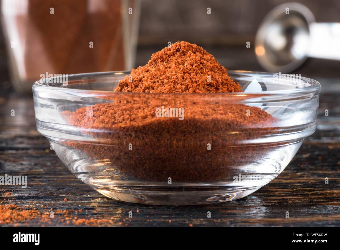 Close-up Of Cayenne Powder In Glass Bowl On Table Stock Photo