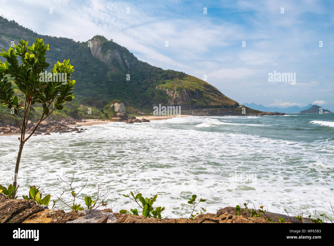 Landscape at Prainha Beach, Rio de Janeiro, on a windy day with the sea full of waves Stock Photo