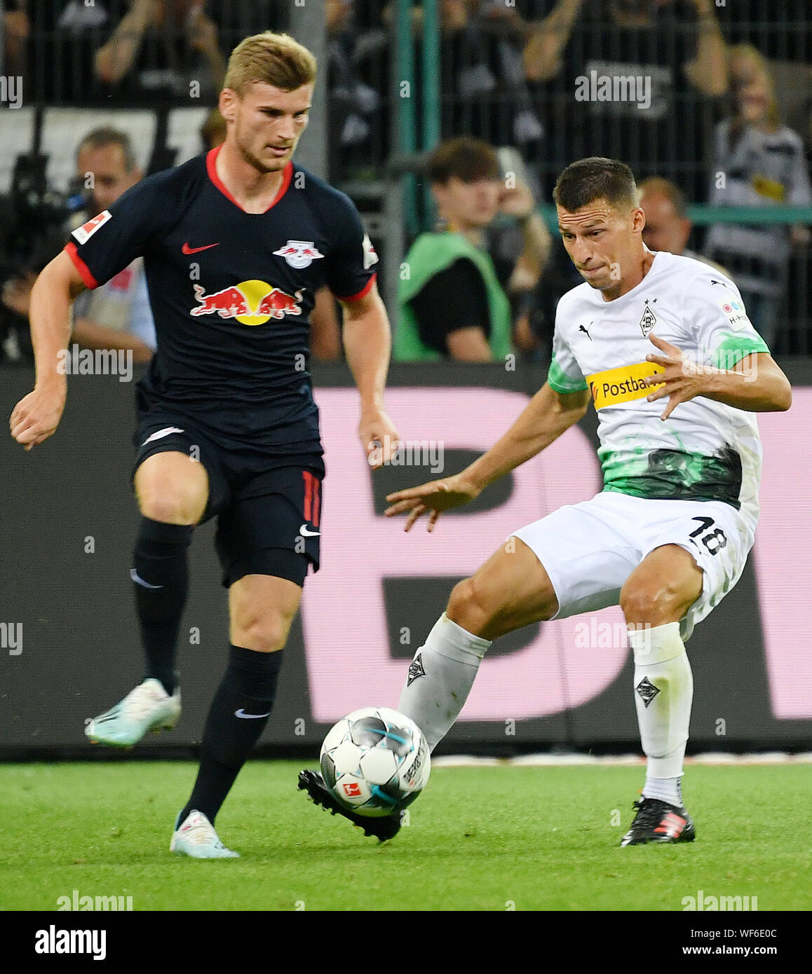 (190831) -- MOENCHENGLADBACH, Aug. 31, 2019 (Xinhua) -- Timo Werner (L) of Leipzig vies with Stefan Lainer of Moenchengladbach during the Bundesliga soccer match between Borussia Moenchengladbach and RB Leipzig in Moenchengladbach, Germany, Aug. 30, 2019. Stock Photo