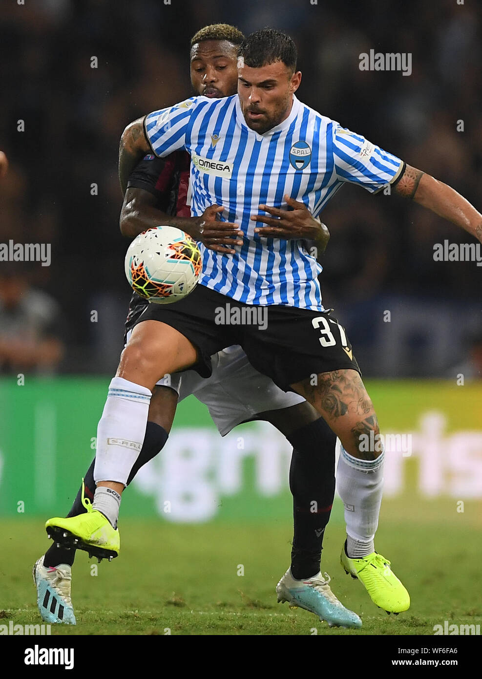 Bologna, Italy. 30th Aug, 2019. Spal's Andrea Petagna (front) vies with Bologna's Stefano Denswil during a Serie A soccer match between Bologna and Spal in Bologna, Italy, Aug 30, 2019. Credit: Alberto Lingria/Xinhua Credit: Xinhua/Alamy Live News Stock Photo