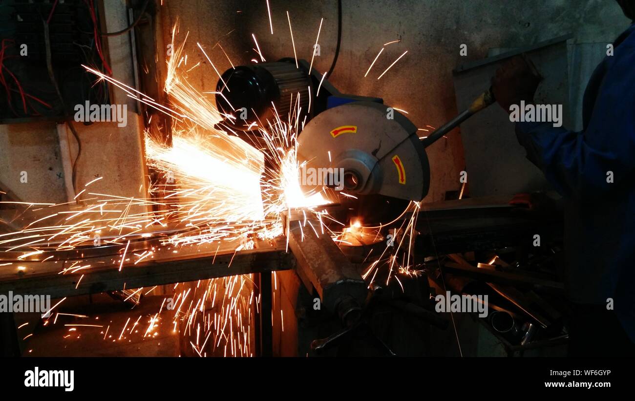 Metal Worker Operating Machinery Stock Photo