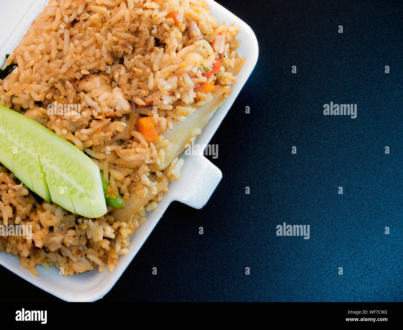 Fried rice in foam box / Food take home Stock Photo - Alamy