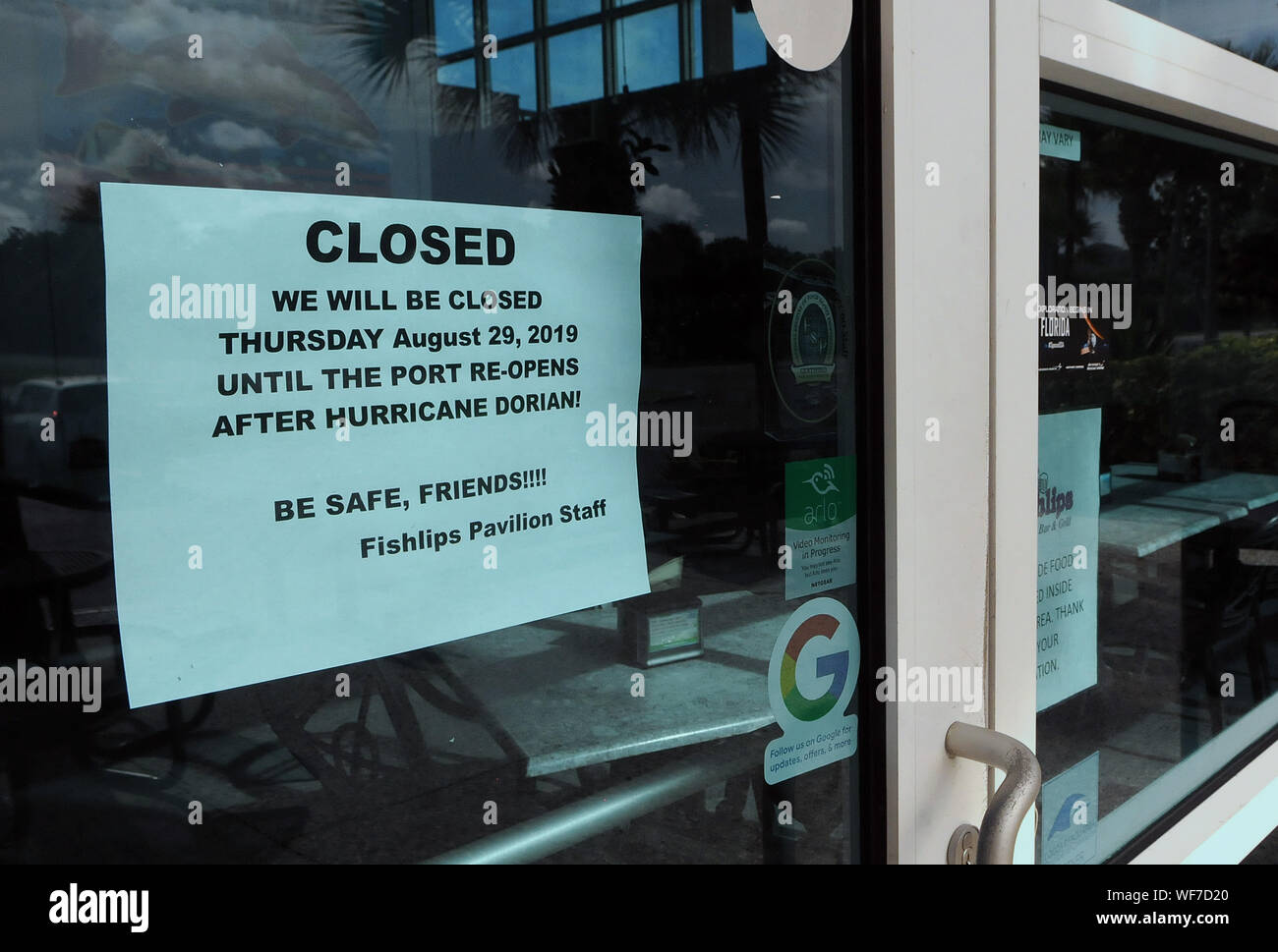 Port Canaveral, Florida, USA. 30th Aug, 2019. A notice is seen posted on the Fishlips Pavilion window at Jetty Park advising patrons that the restaurant will be closed due to Hurricane Dorian. The hurricane has intensified to Category 4 and will threaten parts of the Bahamas and the Southeastern U.S. over Labor Day weekend. Credit: Paul Hennessy/SOPA Images/ZUMA Wire/Alamy Live News Stock Photo