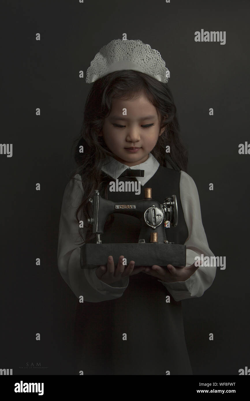 Child girl sewing machine hires stock photography and images Alamy