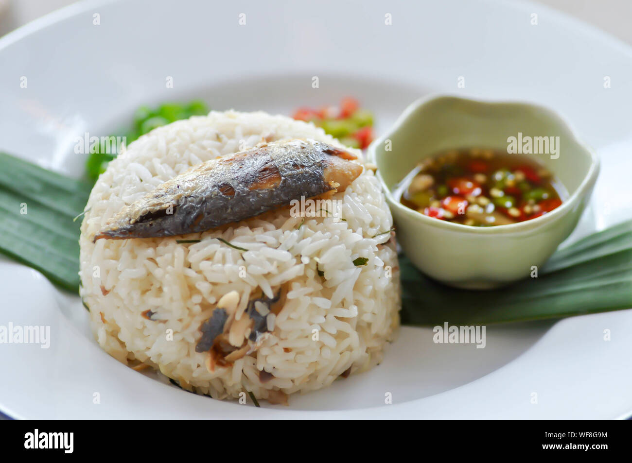 fried rice or stirfried rice with fish, rice topped with mackerel