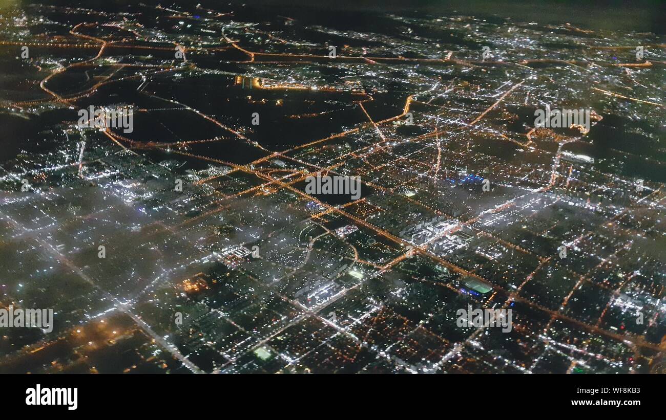 Aerial Shot Of Illuminated Cityscape At Night Stock Photo