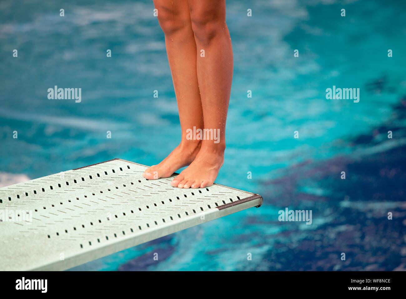 Woman diving board swimming pool hires stock photography and images