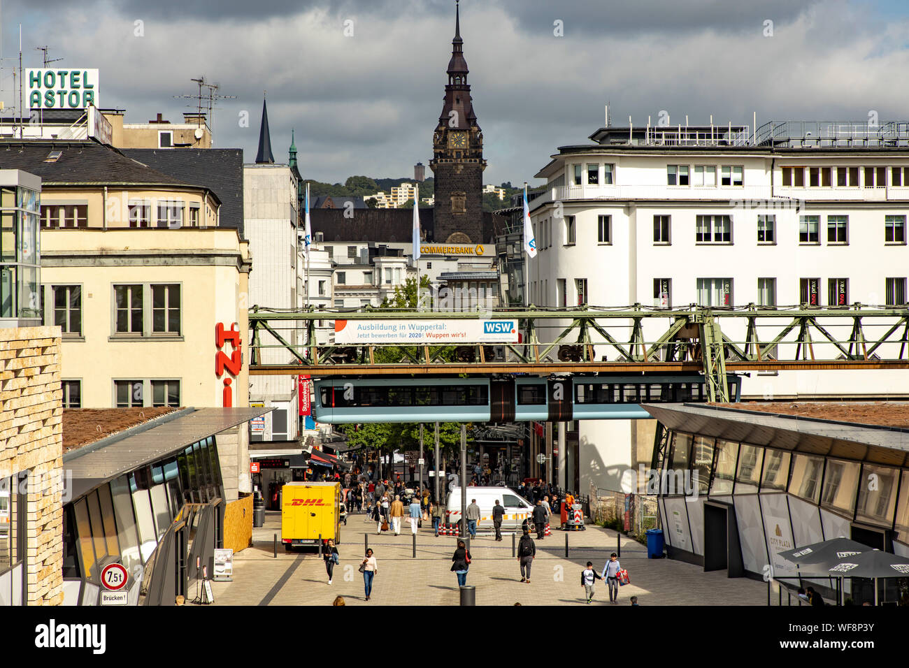 The Wuppertal suspension railway, train of the latest generation #15, downtown, main station stop, journey between residential buildings, shops, Wuppe Stock Photo