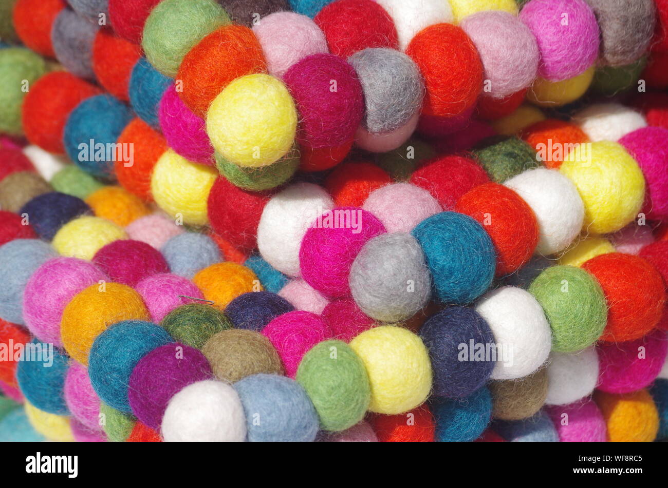 Close-up Of Multi Colored Pom Poms Stock Photo