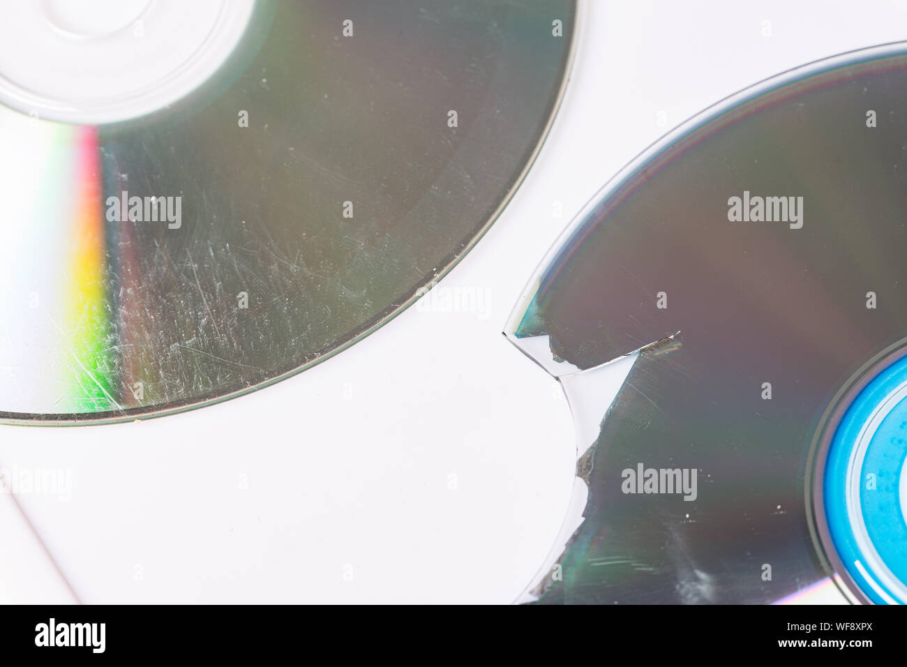 Broken and damaged optical disk storage data Stock Photo