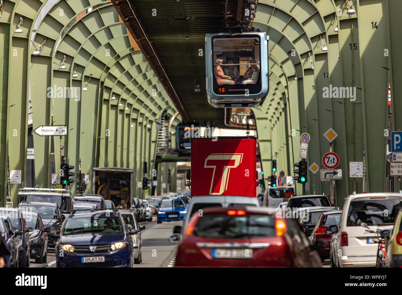The Wuppertal suspension railway, train of the latest generation #15, downtown, over Kaiserstrasse street, in Wuppertal-Vohwinkel district, Stock Photo