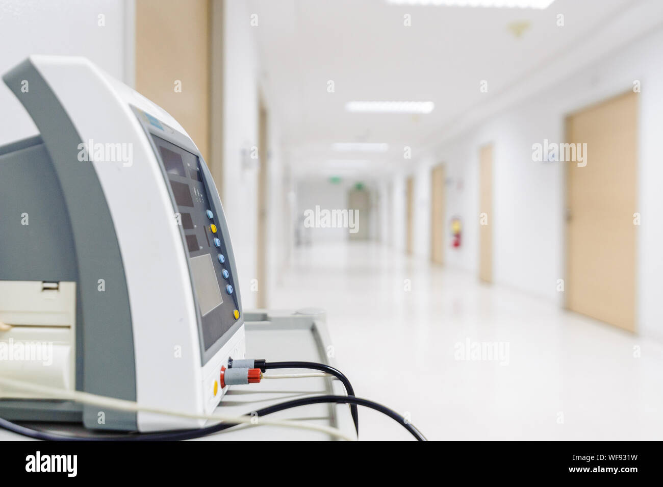 Vital signs patient monitor placed on corridor of the hospital. Stock Photo