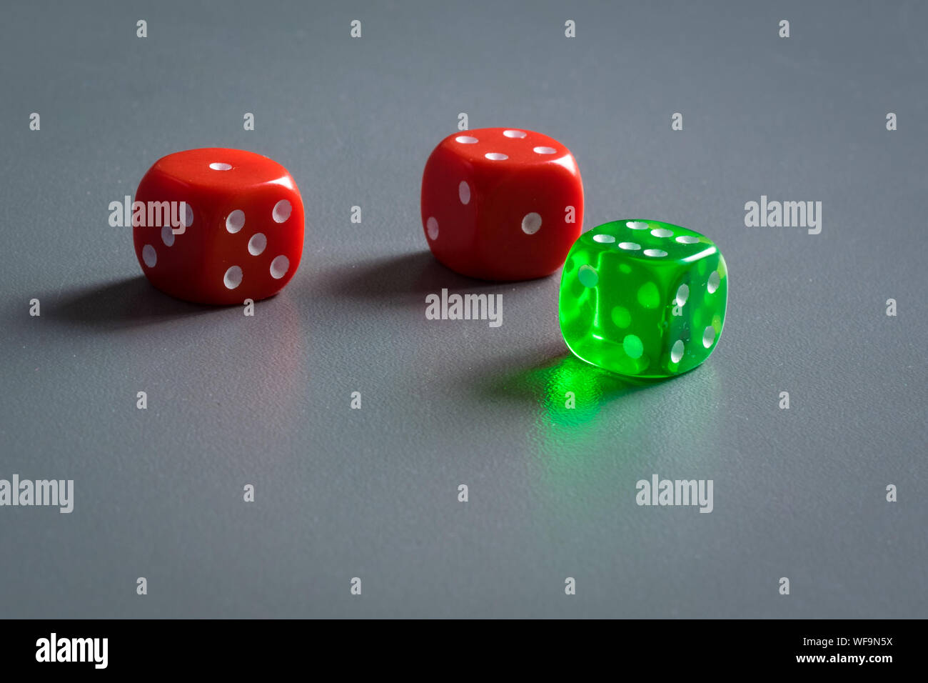 Colorful dice on dark grey background Stock Photo