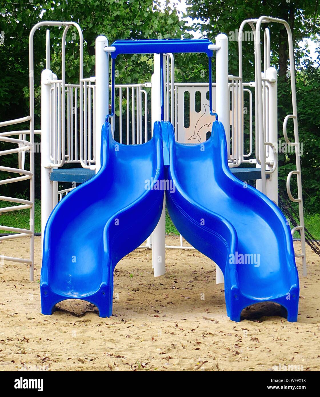 Blue Slide In Playground Stock Photo