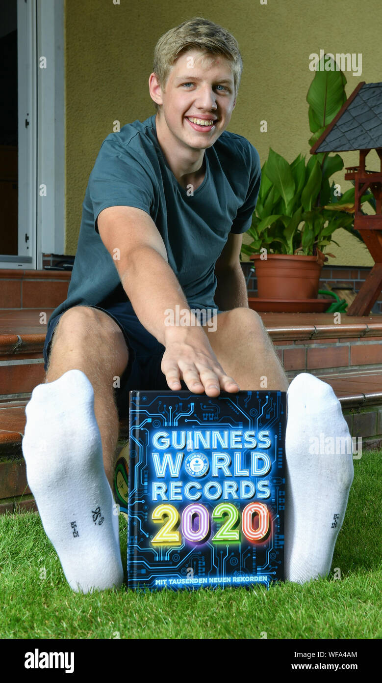 Berlin, Germany. 24th Aug, 2019. 16-year-old Lars Motza from Berlin is the teenager with the longest feet in the world. He can be found in the new Guinness Book of Records. His left foot measures 35.05 centimetres, his right 34.98 centimetres, which corresponds to shoe size 57. Credit: Jens Kalaene/dpa-Zentralbild/dpa/Alamy Live News Stock Photo