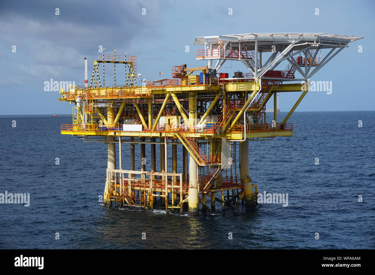 Offshore Platform In Sea Against Sky Stock Photo