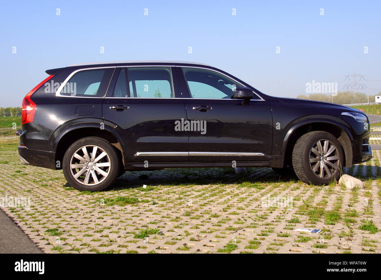 Almere, Flevoland, The Netherlands - March 17, 2018: Black Volvo XC90 SUV parked on parked on a public parking lot. Nobody in de vehicle. Stock Photo