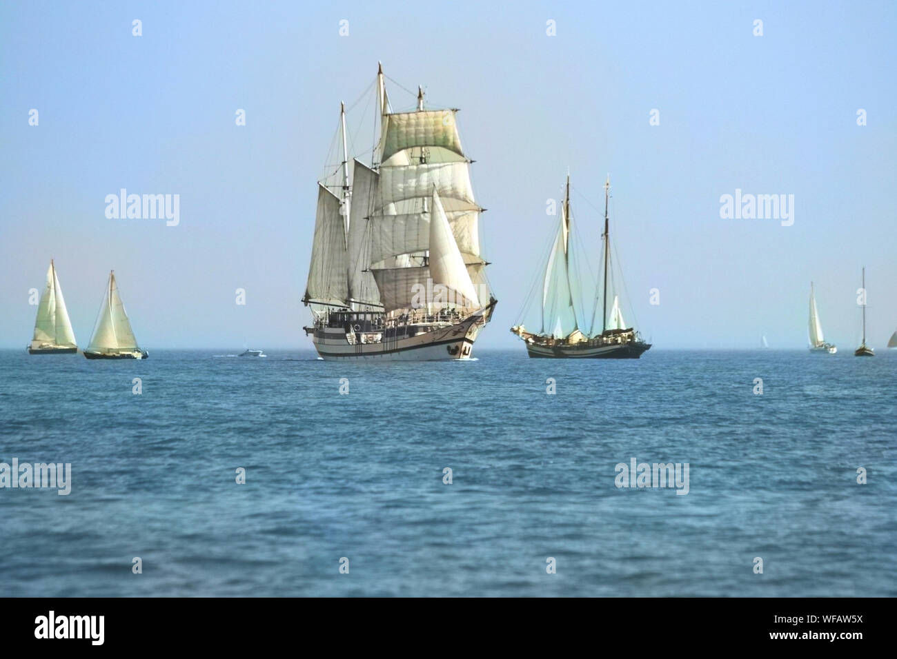 Sailing in a tall ship in Volendam sea is compelling because it is uncontrived, springing spontaneously from the voyage itself. Stock Photo